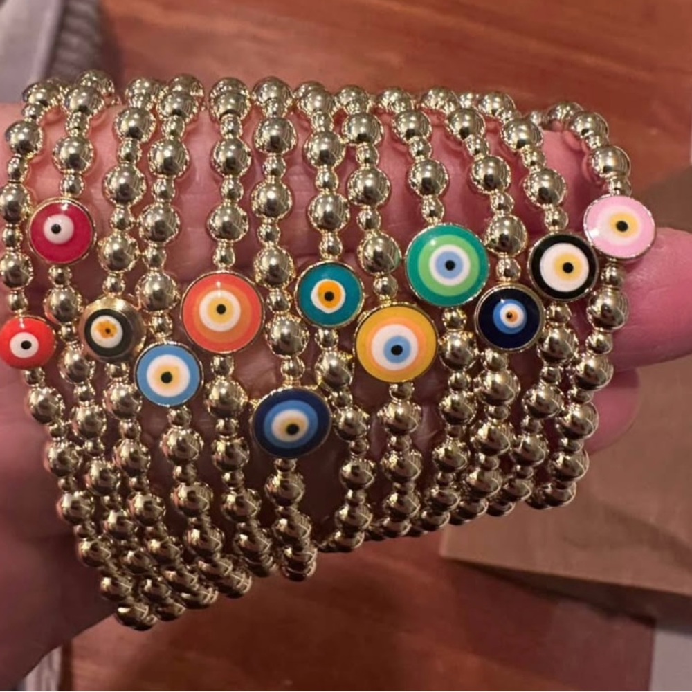 Hand made in Greece. Gold fill beads w/ evil eye, stretch cord. $20 your choice